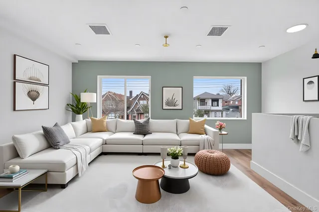 a living room with furniture a rug and a window