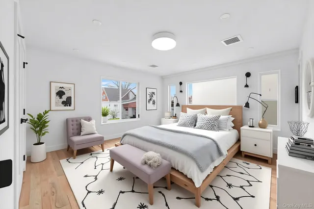 a bedroom with a bed and a couch