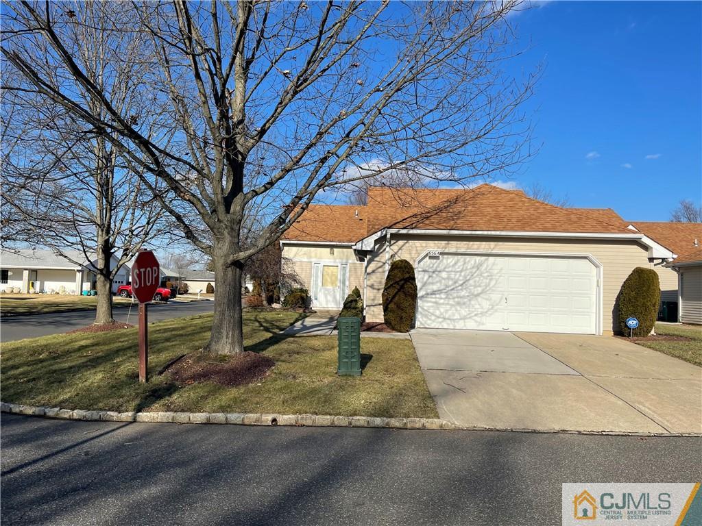 656 Nutley Drive, Unit A Monroe Township, NJ 08831 - Photo 2 of 25 a front view of a house with a yard
