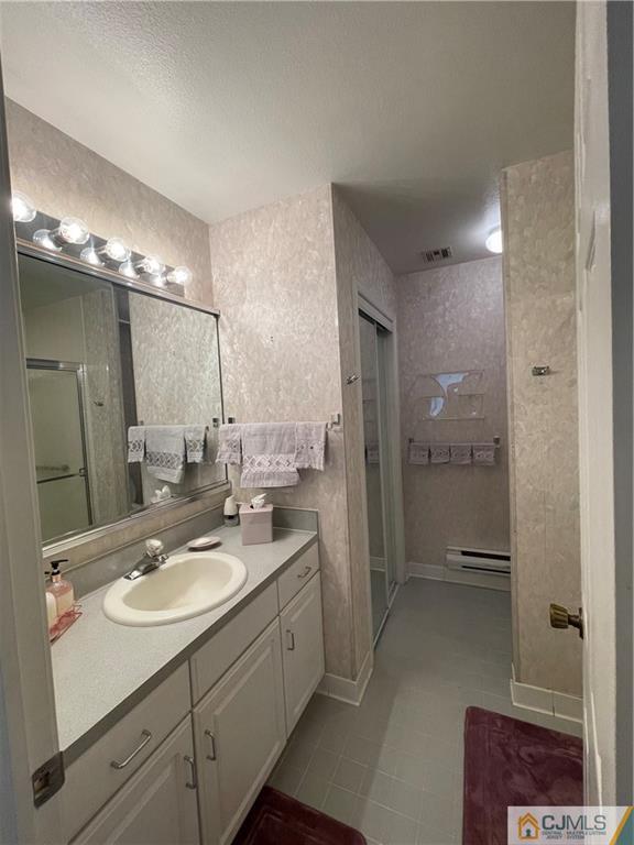 656 Nutley Drive, Unit A Monroe Township, NJ 08831 - Photo 21 of 25 a bathroom with a sink shower and a mirror