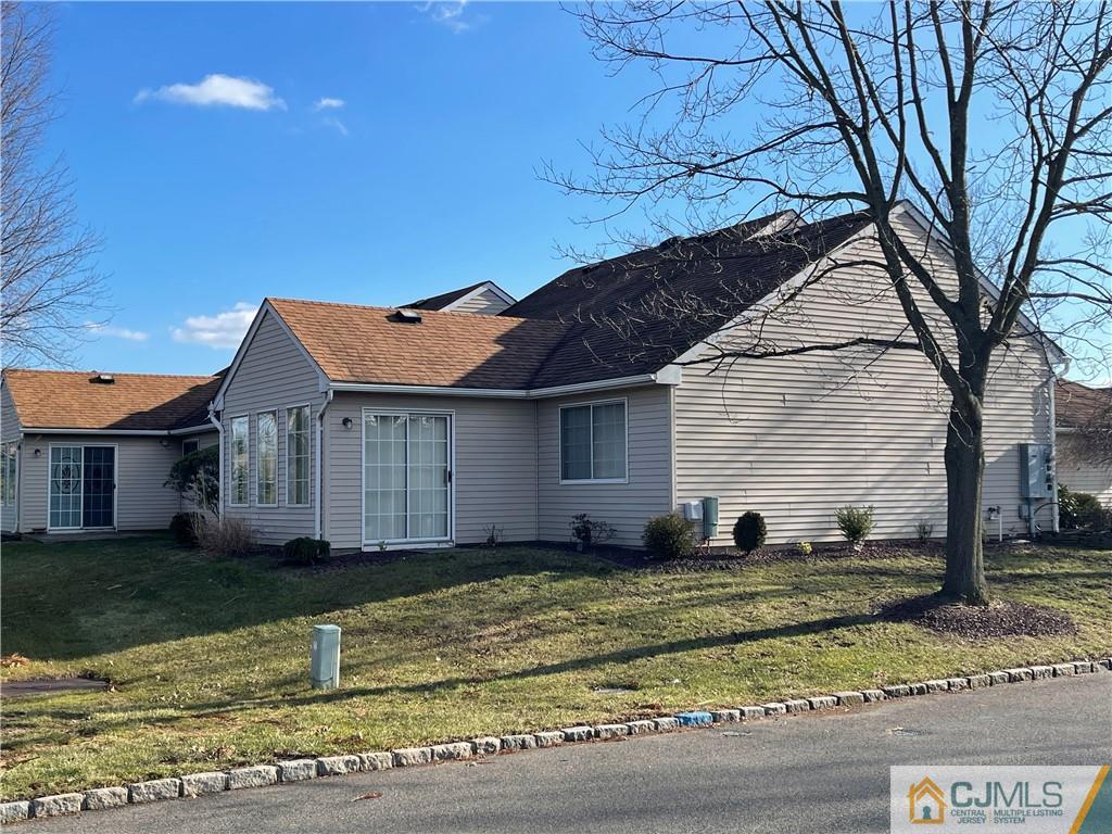 656 Nutley Drive, Unit A Monroe Township, NJ 08831 - Photo 4 of 25 a view of a house with a yard
