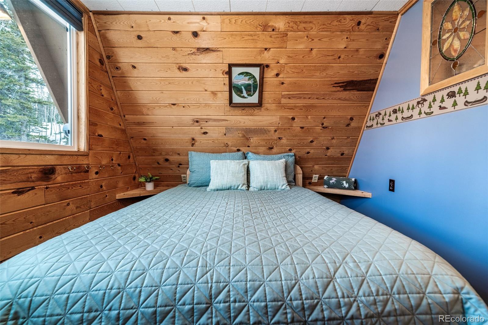 340 Wampum Lane Como, CO 80456 - Photo 20 of 35 a bedroom with a bed and a dresser