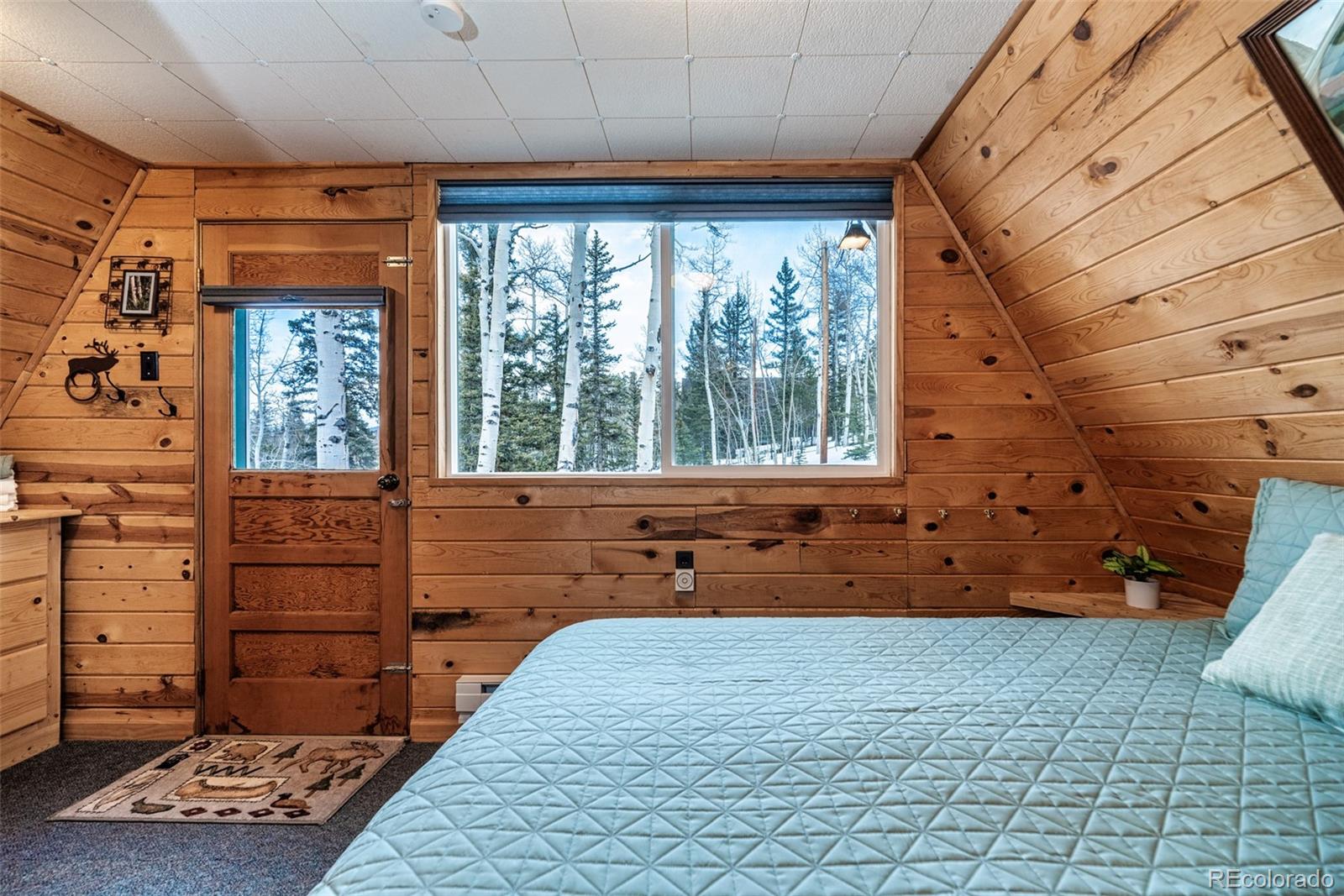 340 Wampum Lane Como, CO 80456 - Photo 22 of 35 a bedroom with a bed and a dresser