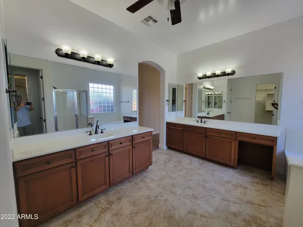 a bathroom with a double vanity sink and a mirror