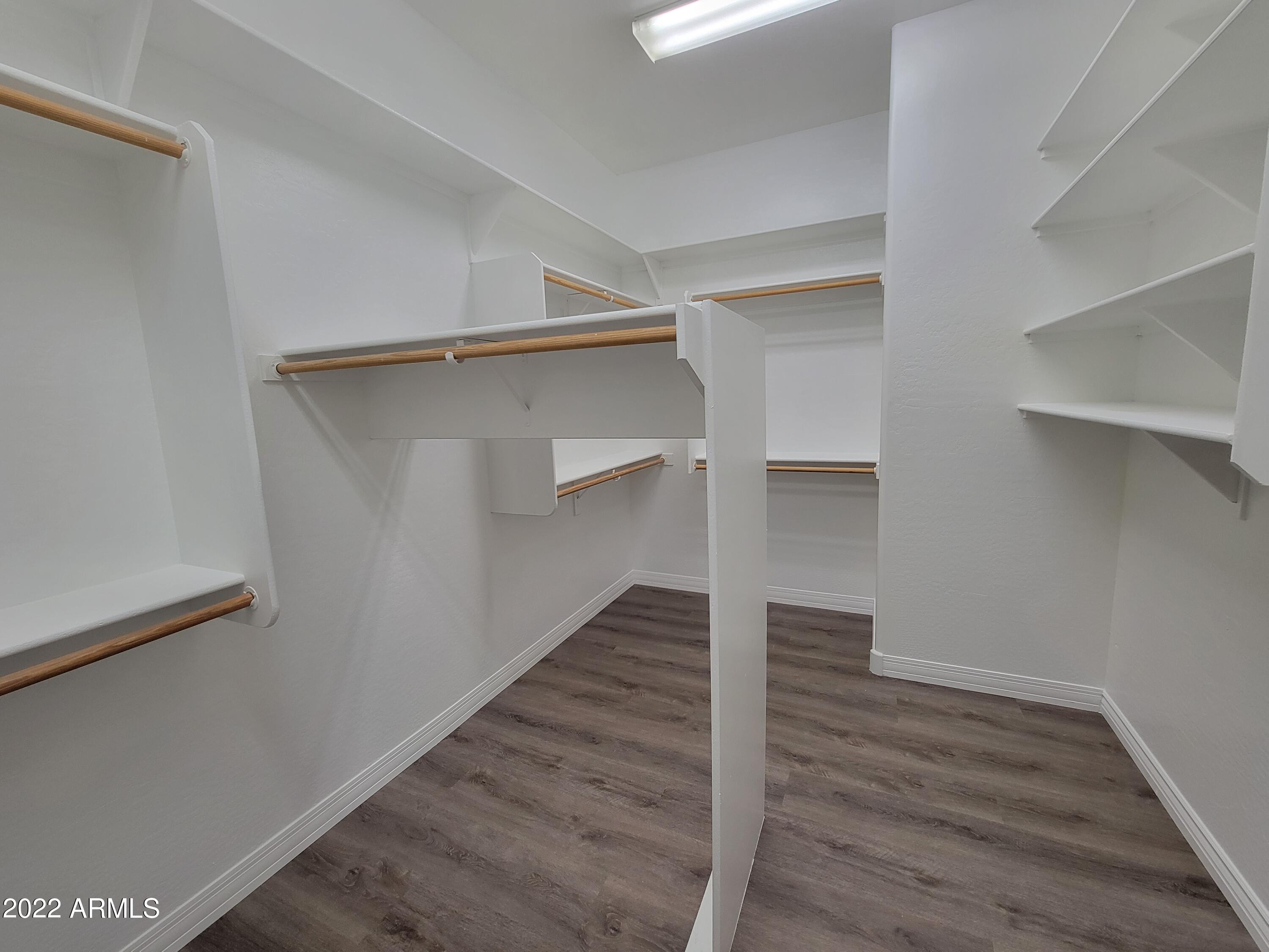 6335 South Roanoke Street Gilbert, AZ 85298 - Photo 19 of 36 a view of an empty walk in closet