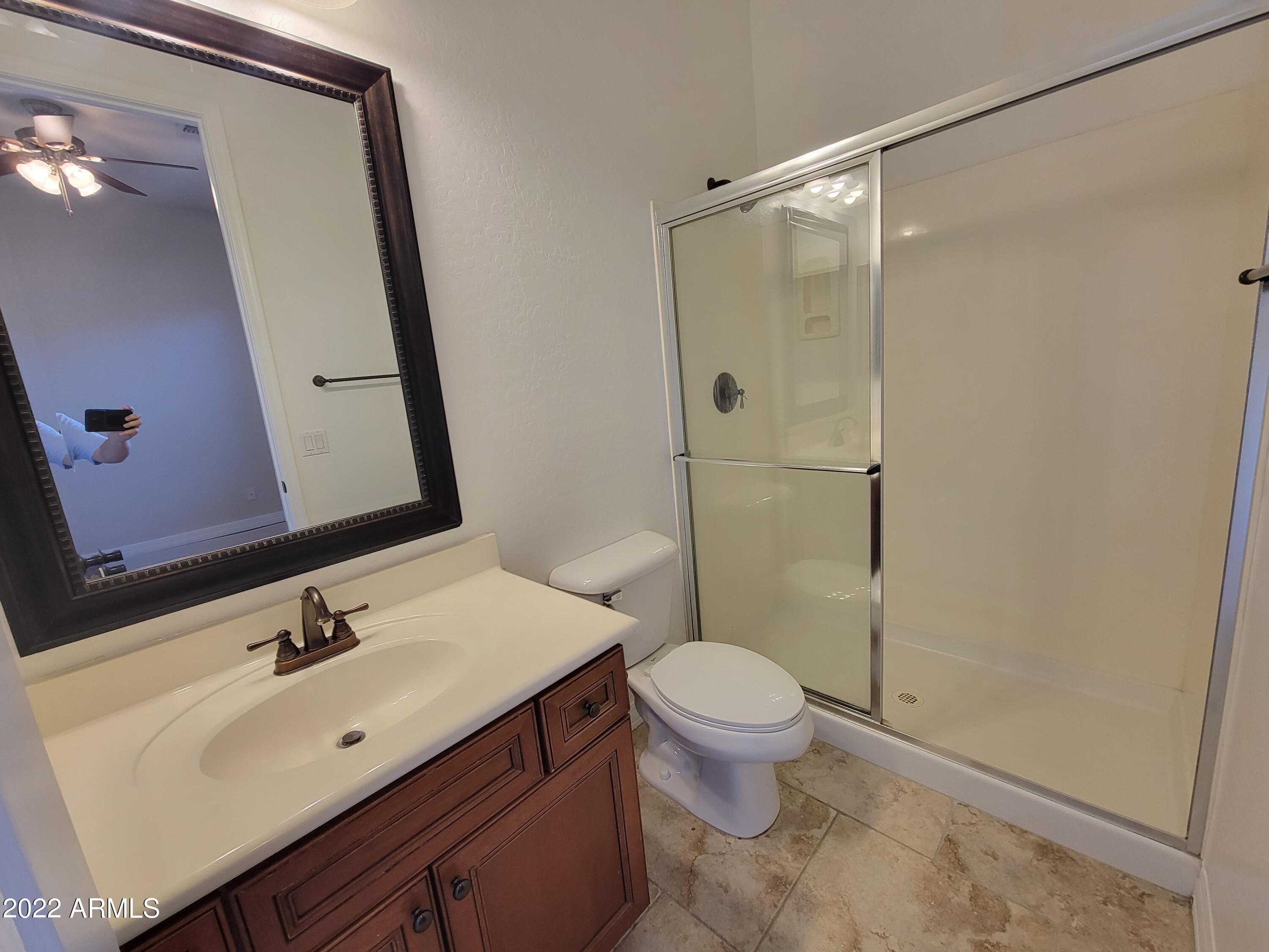 6335 South Roanoke Street Gilbert, AZ 85298 - Photo 24 of 36 a bathroom with a sink vanity mirror and toilet