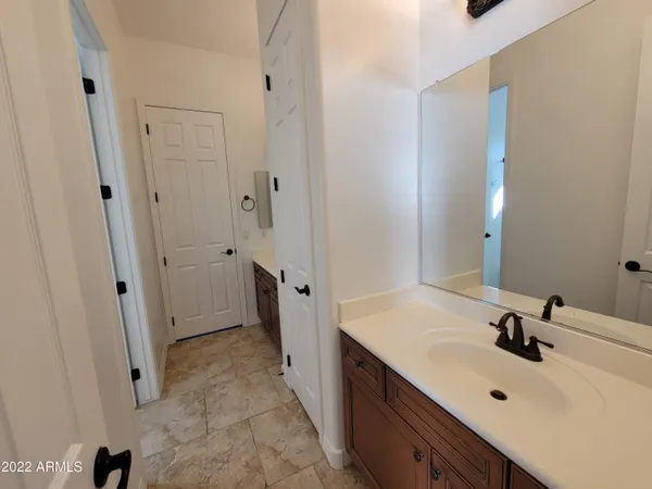 a bathroom with a sink and mirror