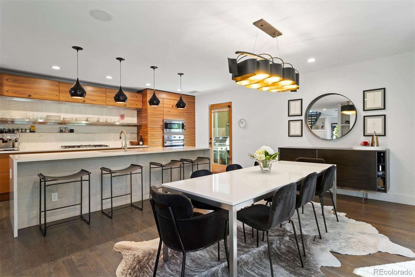 3400 Tejon Street Denver, CO 80211 - Photo 12 of 40 a kitchen with a table and chairs in it