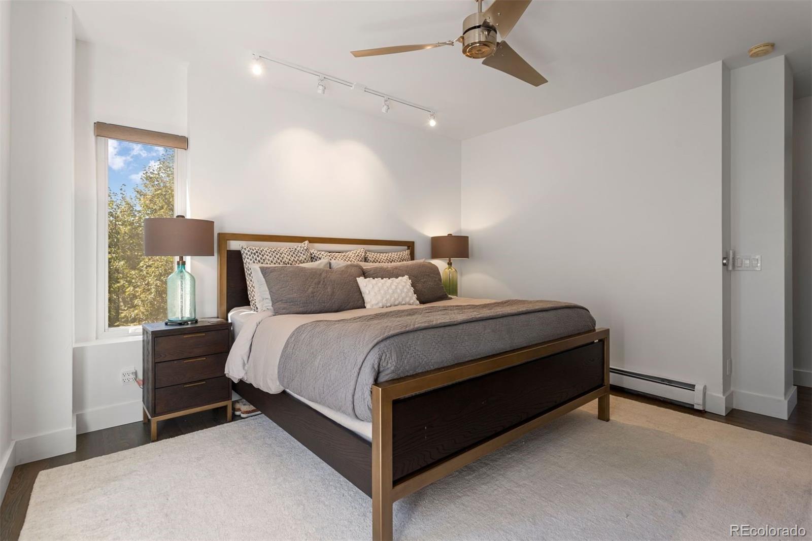 3400 Tejon Street Denver, CO 80211 - Photo 29 of 40 a bed sitting in a bedroom next to a window