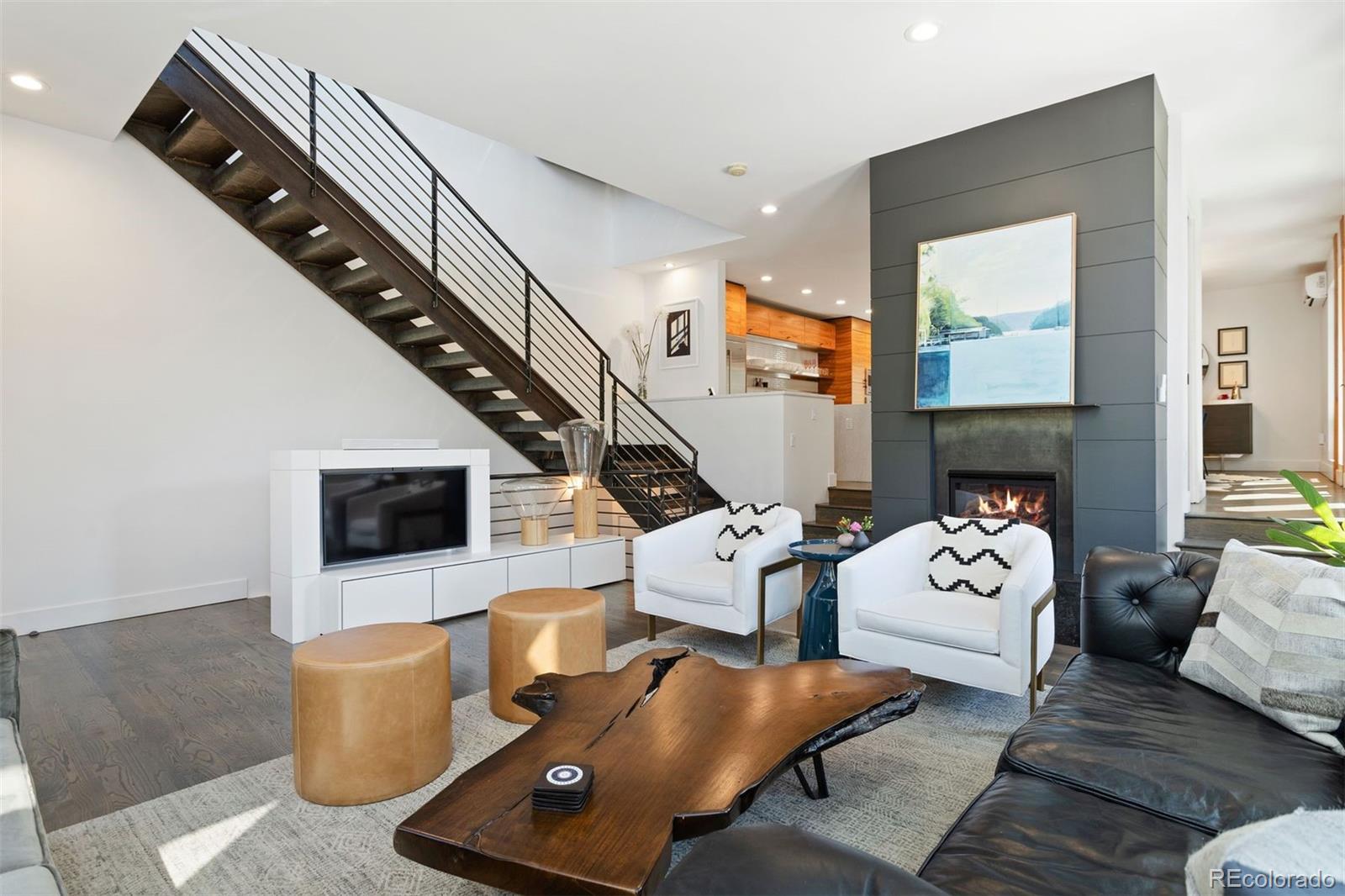 3400 Tejon Street Denver, CO 80211 - Photo 6 of 40 a living room with furniture and a fireplace