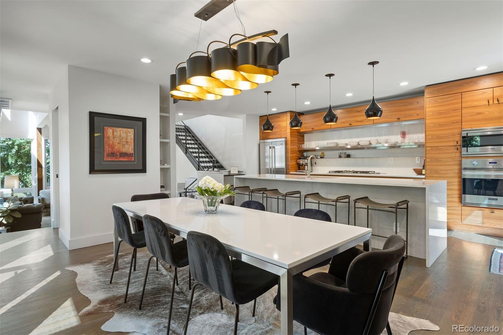 3400 Tejon Street Denver, CO 80211 - Photo 10 of 40 a view of a dining room with furniture and wooden floor