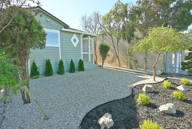 a backyard of a house with lots of green space