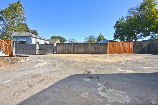 a view of backyard with a small pool