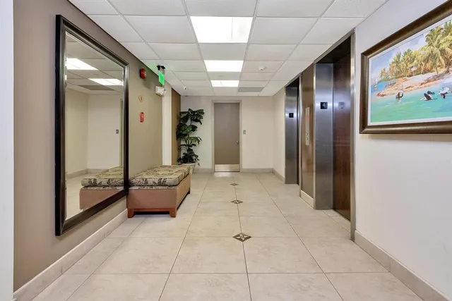 a lobby with furniture and window