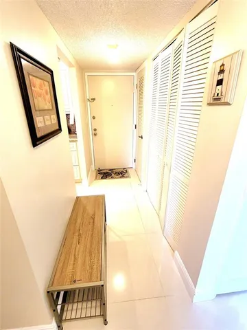 a view of a hallway with windows