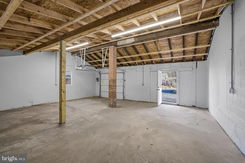 a view of a room with wooden walls