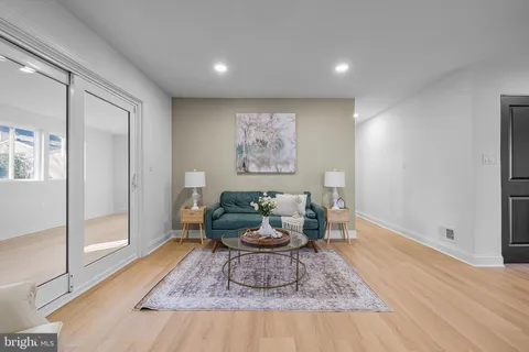 a living room with furniture and a rug