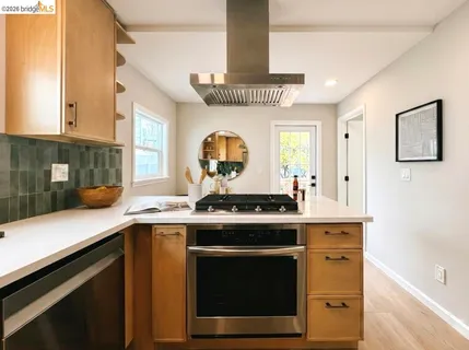 a kitchen with a stove and a sink