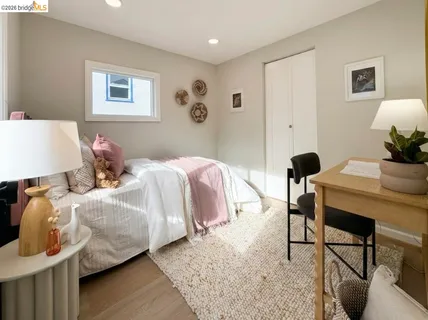 a bedroom with two beds and a table