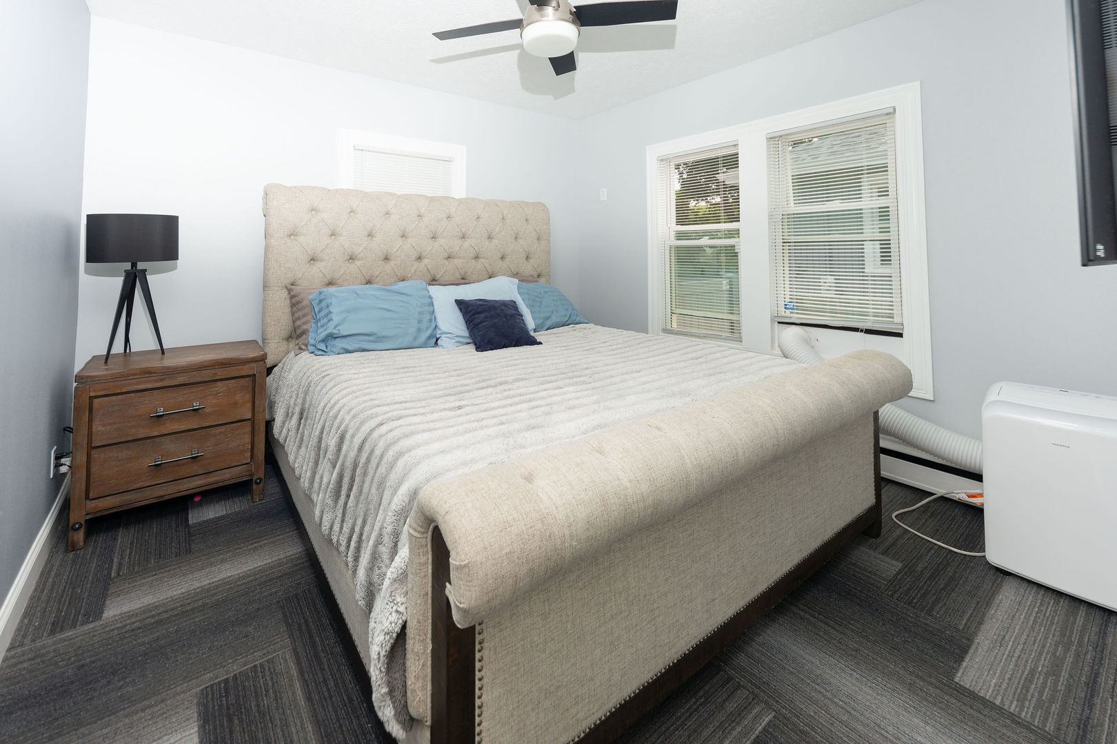 1719 Post Avenue Rockford, IL 61103 - Photo 21 of 52 a bedroom with a bed and a flat tv screen on dresser