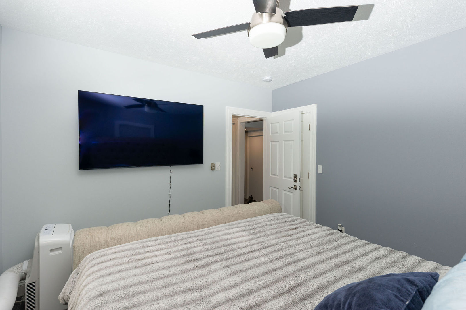 1719 Post Avenue Rockford, IL 61103 - Photo 22 of 52 a bedroom with a bed and a flat screen tv