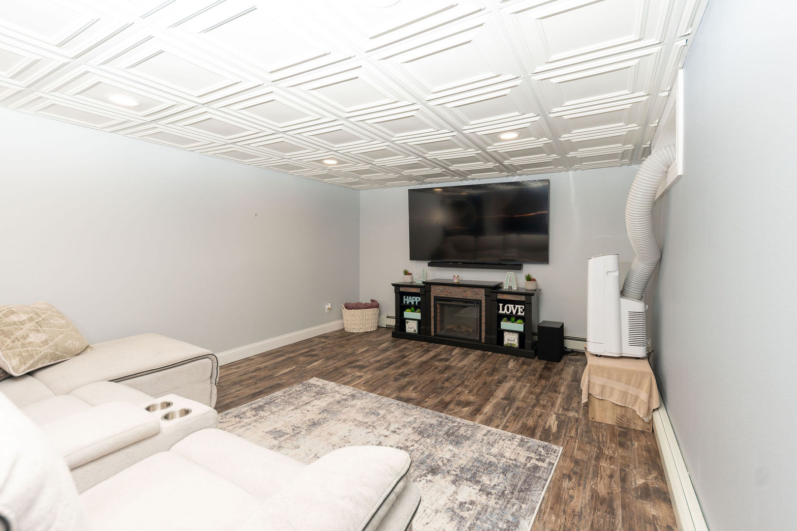 1719 Post Avenue Rockford, IL 61103 - Photo 27 of 52 a view of a livingroom with furniture and a flat screen tv