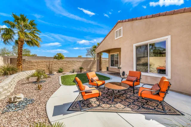 an outdoor space with patio furniture