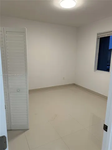 a bathroom with a sink mirror vanity and toilet