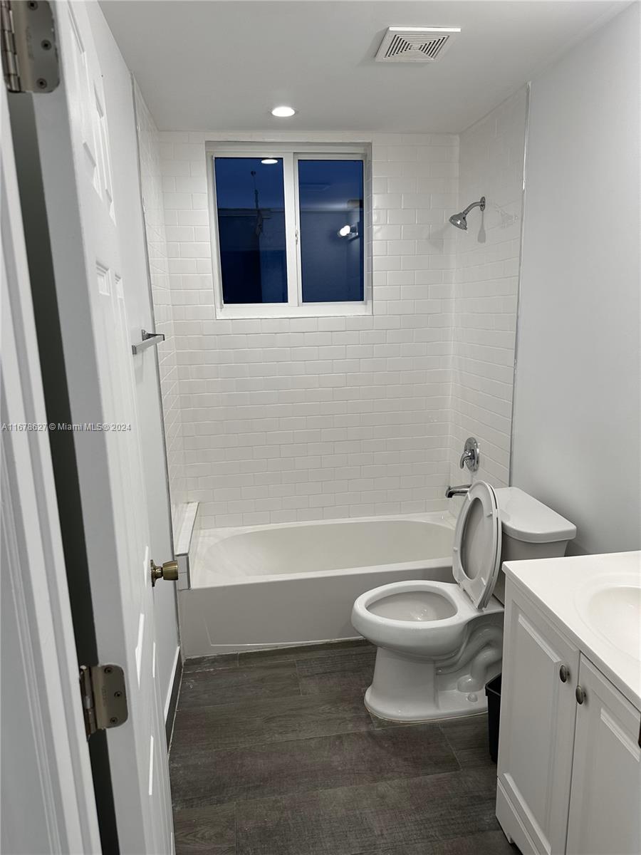 620 West 29th Street Hialeah, FL 33012 - Photo 23 of 26 a white toilet sitting next to a bath tub