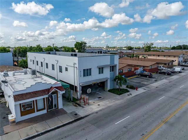 an aerial view of a house with outdoor space