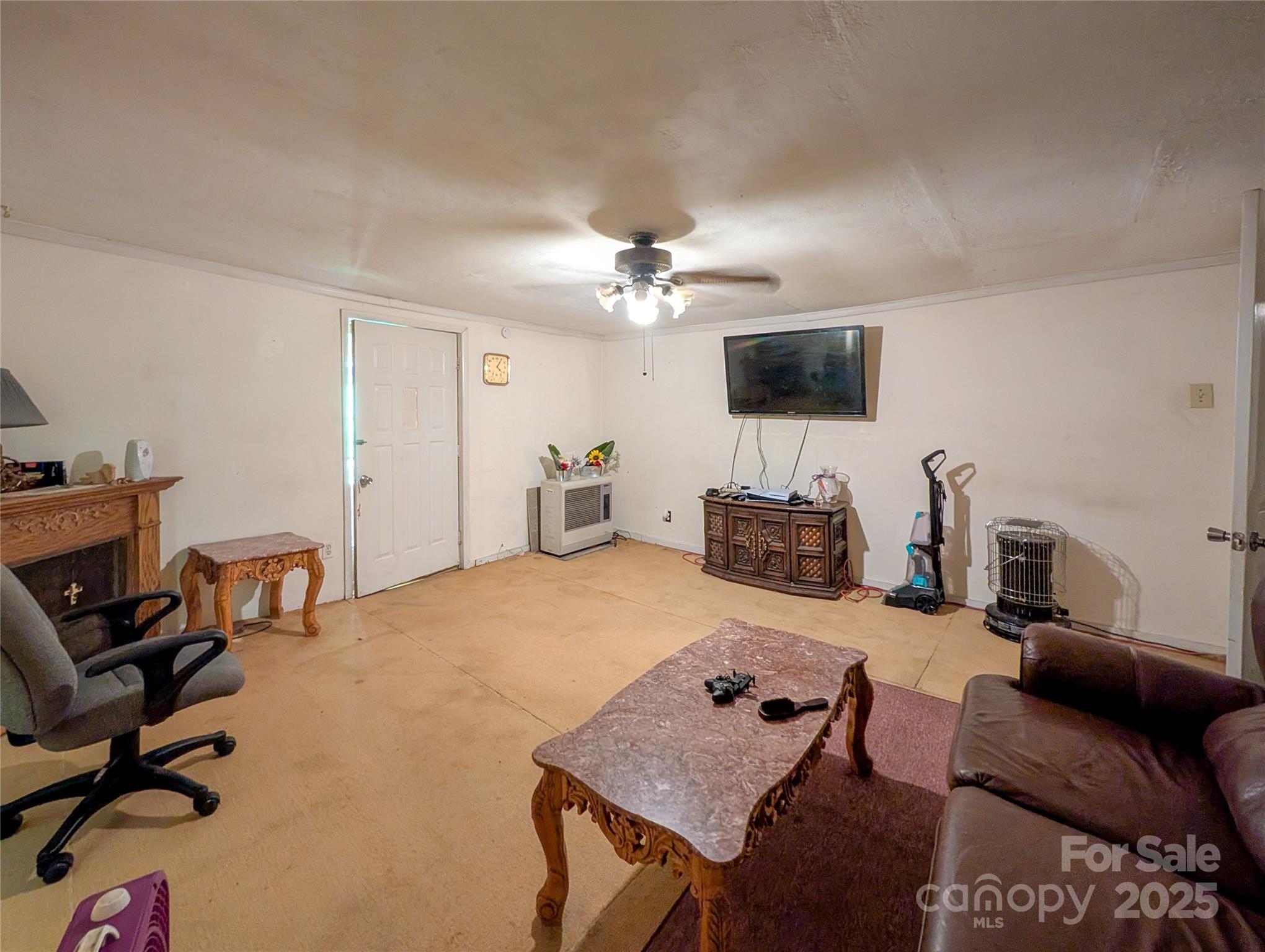 540 Pound Mill Branch Road Burnsville, NC 28714 - Photo 24 of 43 a living room with furniture and a flat screen tv