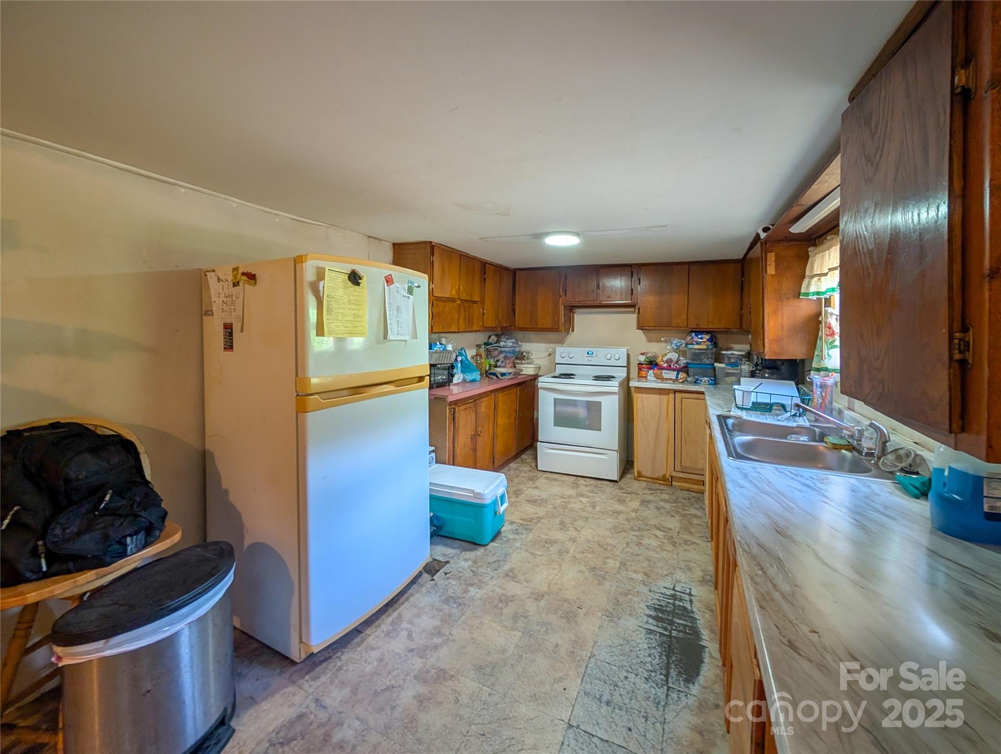 540 Pound Mill Branch Road Burnsville, NC 28714 - Photo 26 of 43 a kitchen with stainless steel appliances granite countertop a refrigerator stove and oven
