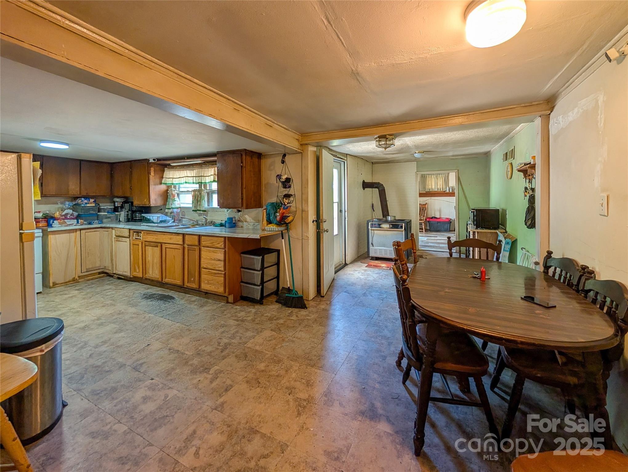 540 Pound Mill Branch Road Burnsville, NC 28714 - Photo 27 of 43 a kitchen with stainless steel appliances granite countertop a stove and a refrigerator
