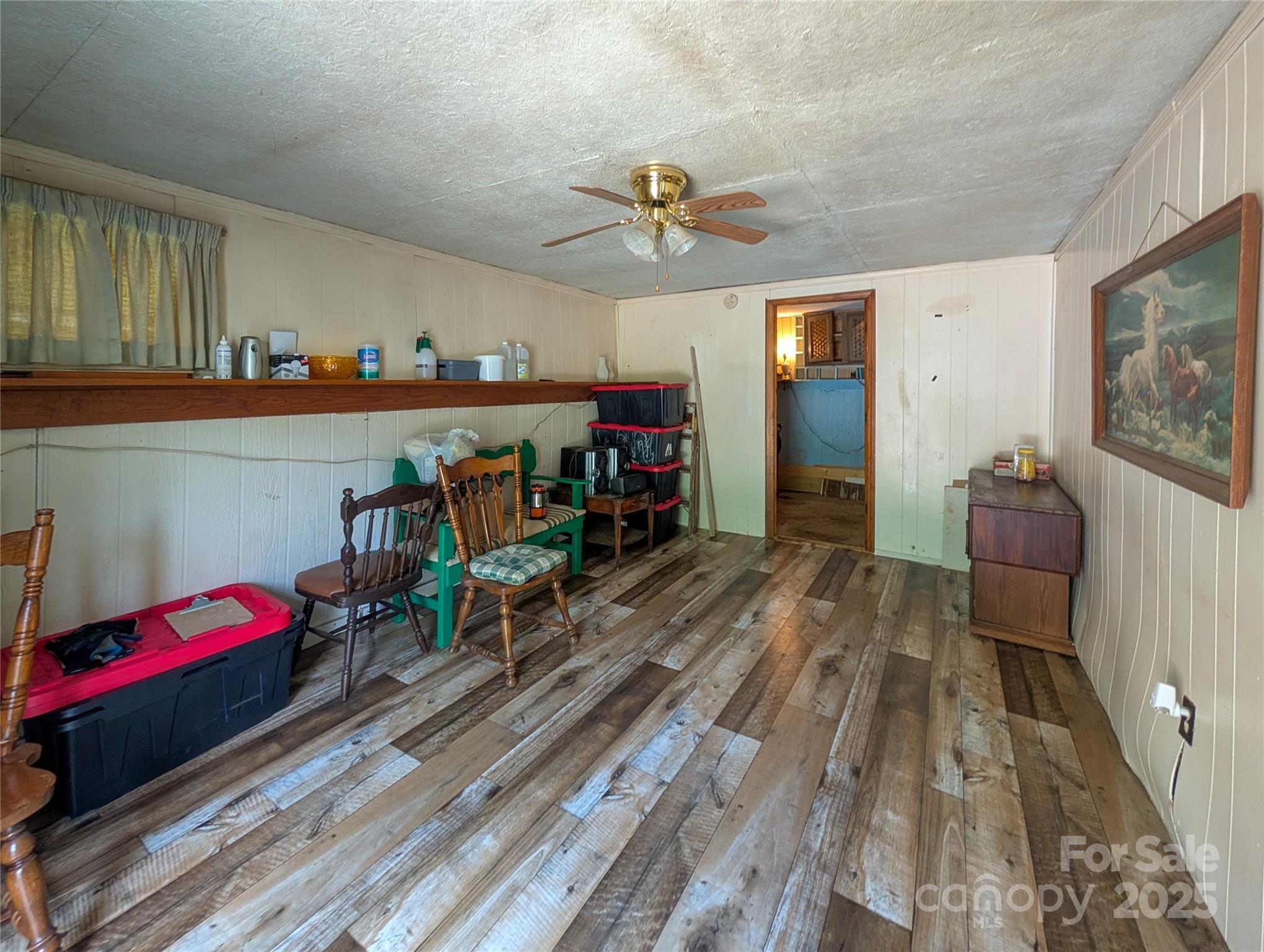540 Pound Mill Branch Road Burnsville, NC 28714 - Photo 30 of 43 a living room with furniture and a wooden floor