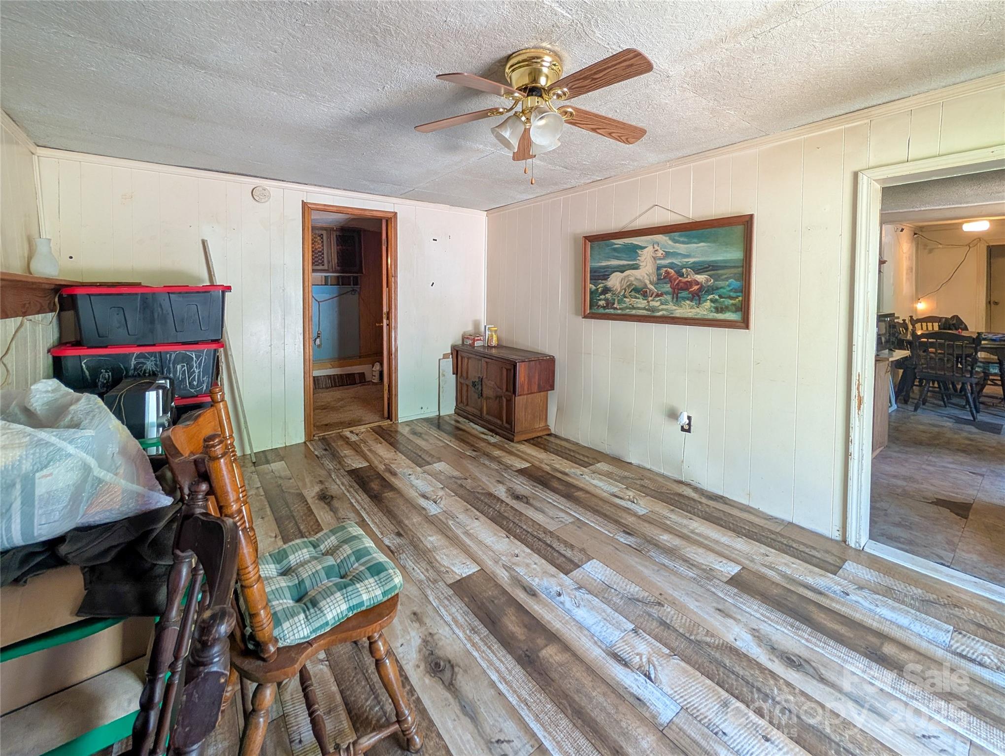 540 Pound Mill Branch Road Burnsville, NC 28714 - Photo 31 of 43 a bedroom with a bed and a chandelier