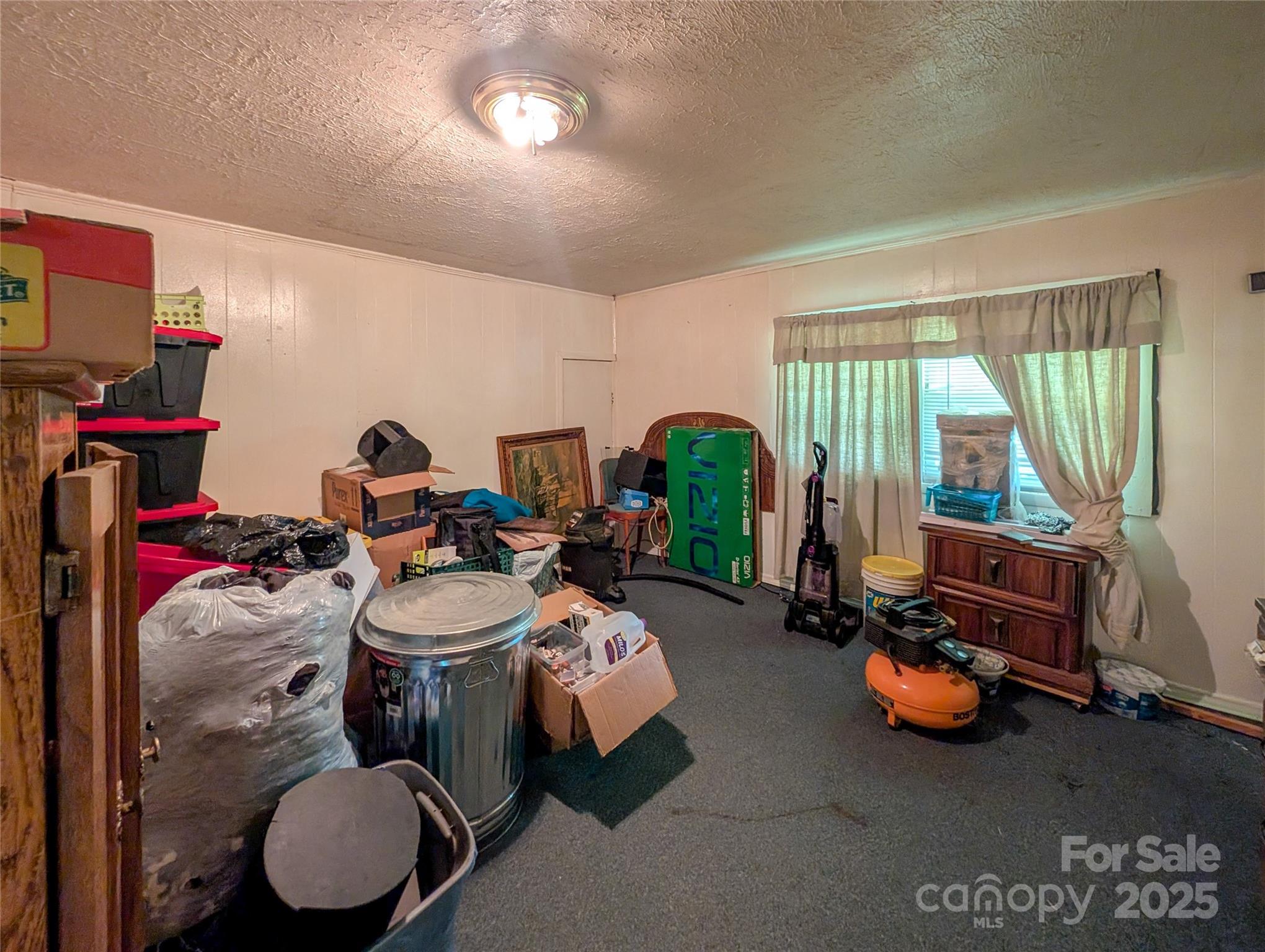 540 Pound Mill Branch Road Burnsville, NC 28714 - Photo 33 of 43 a room with furniture toys and a large window