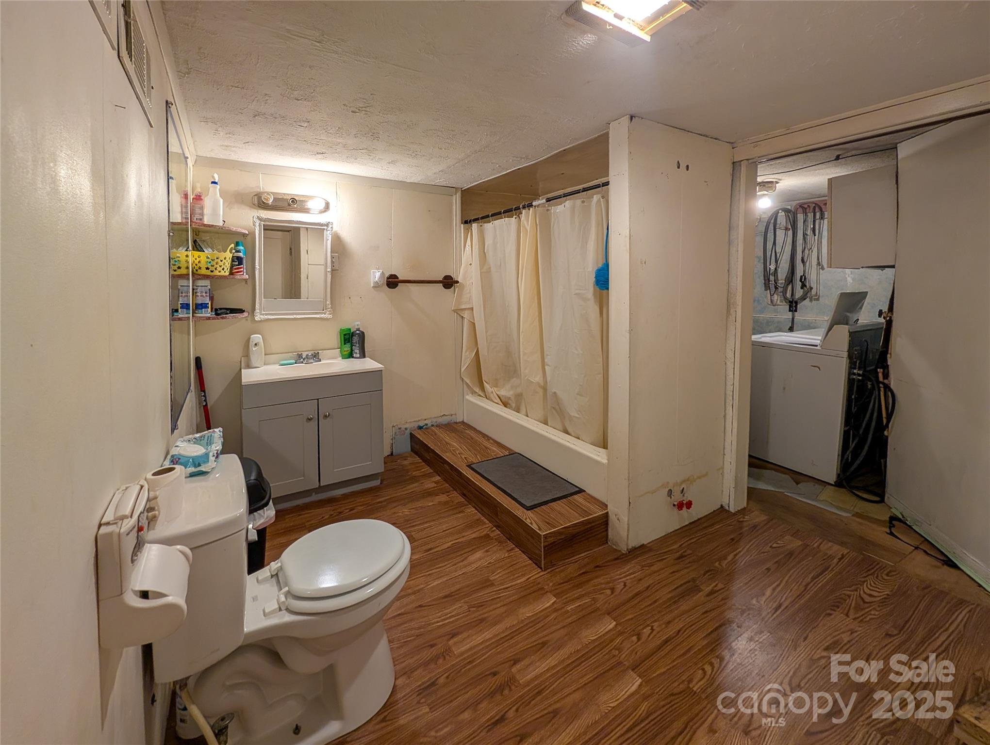 540 Pound Mill Branch Road Burnsville, NC 28714 - Photo 38 of 43 a bathroom with a toilet a sink and mirror