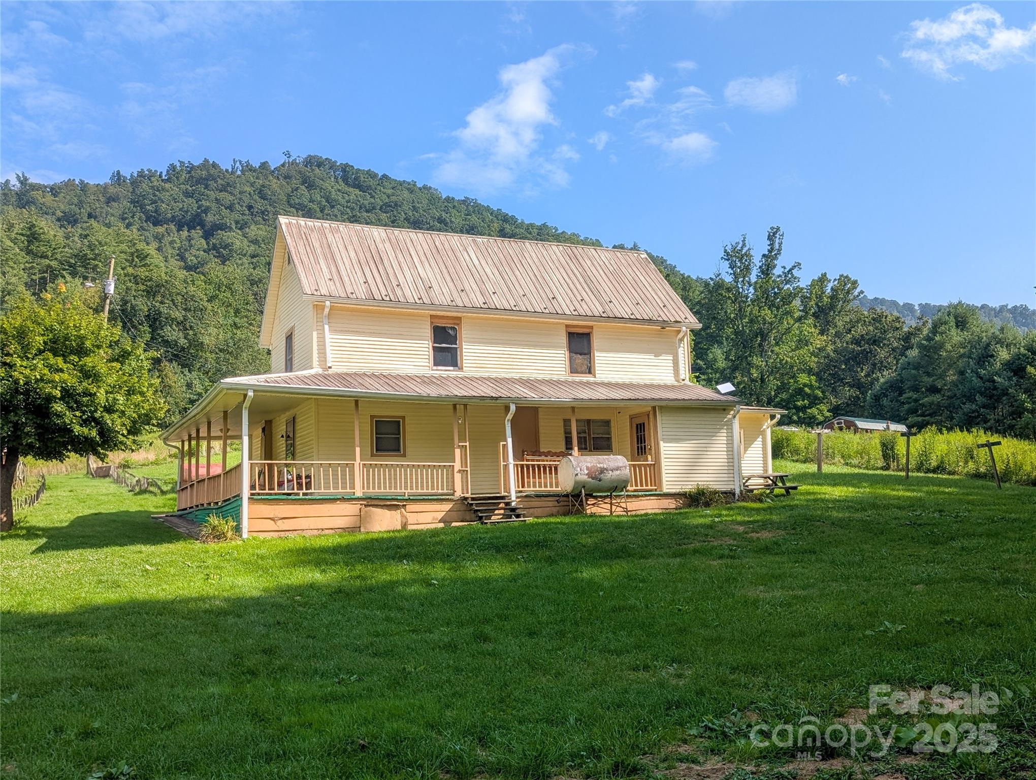 540 Pound Mill Branch Road Burnsville, NC 28714 - Photo 4 of 43 a view of a house with a yard