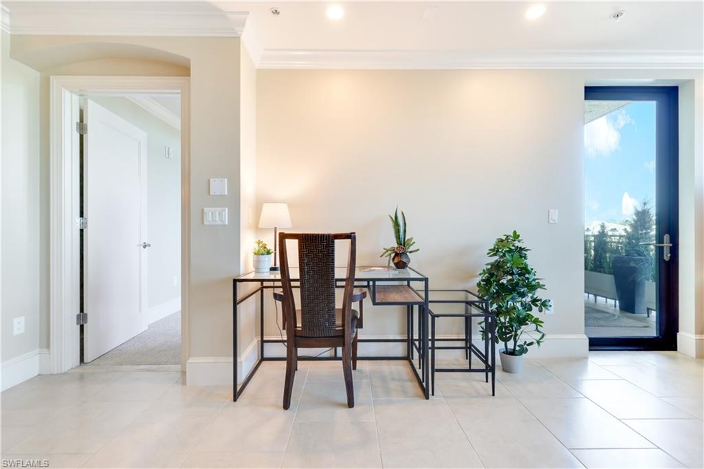 9115 Strada Place, Unit 5205 Naples, FL 34108 - Photo 10 of 36 a view of a workspace room with furniture and potted plant