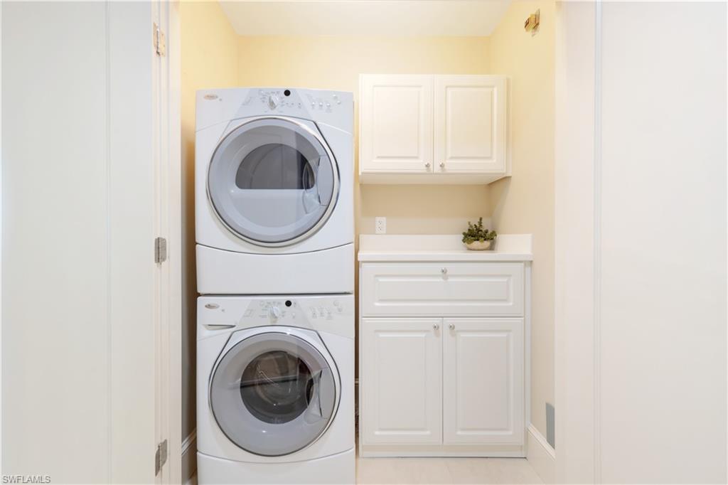 9115 Strada Place, Unit 5205 Naples, FL 34108 - Photo 19 of 36 a utility room with dryer and washer
