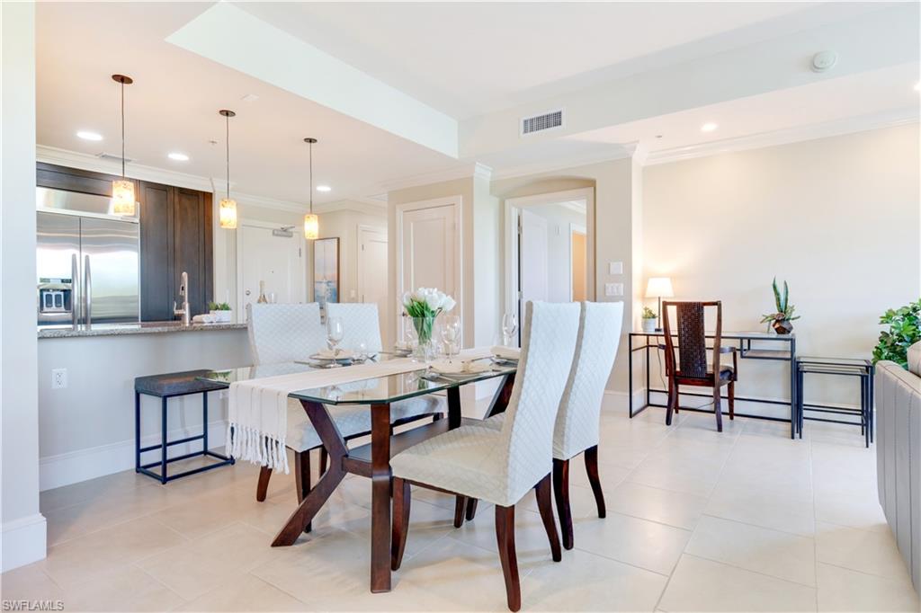 9115 Strada Place, Unit 5205 Naples, FL 34108 - Photo 3 of 36 a view of a a dining room with furniture