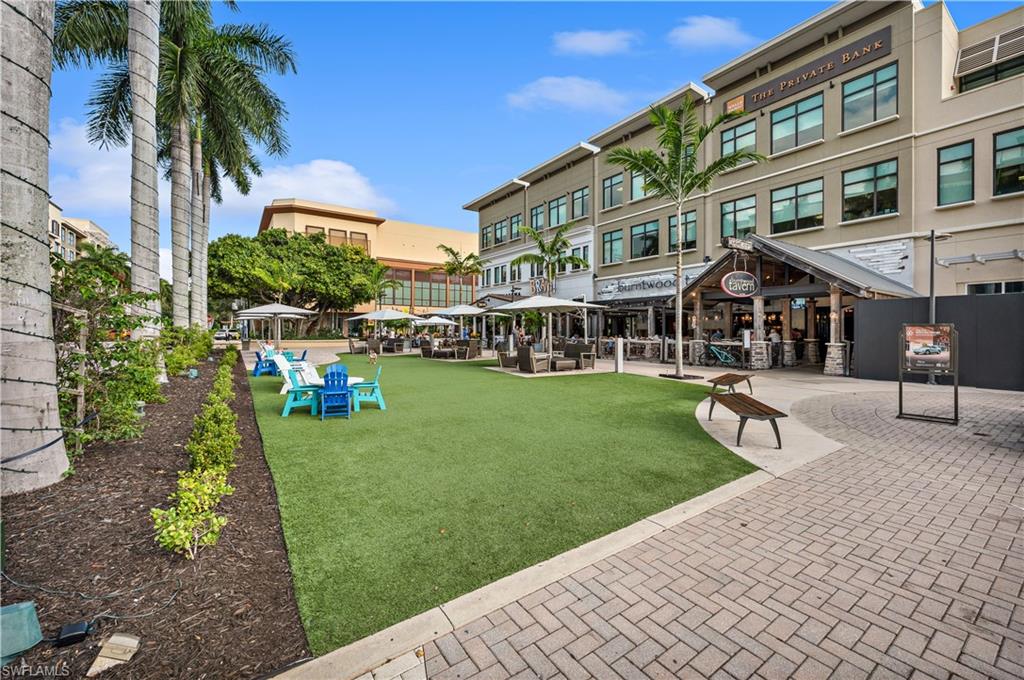 9115 Strada Place, Unit 5205 Naples, FL 34108 - Photo 33 of 36 a house view with a garden space