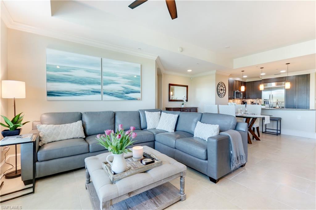 9115 Strada Place, Unit 5205 Naples, FL 34108 - Photo 5 of 36 a living room with furniture and a large window