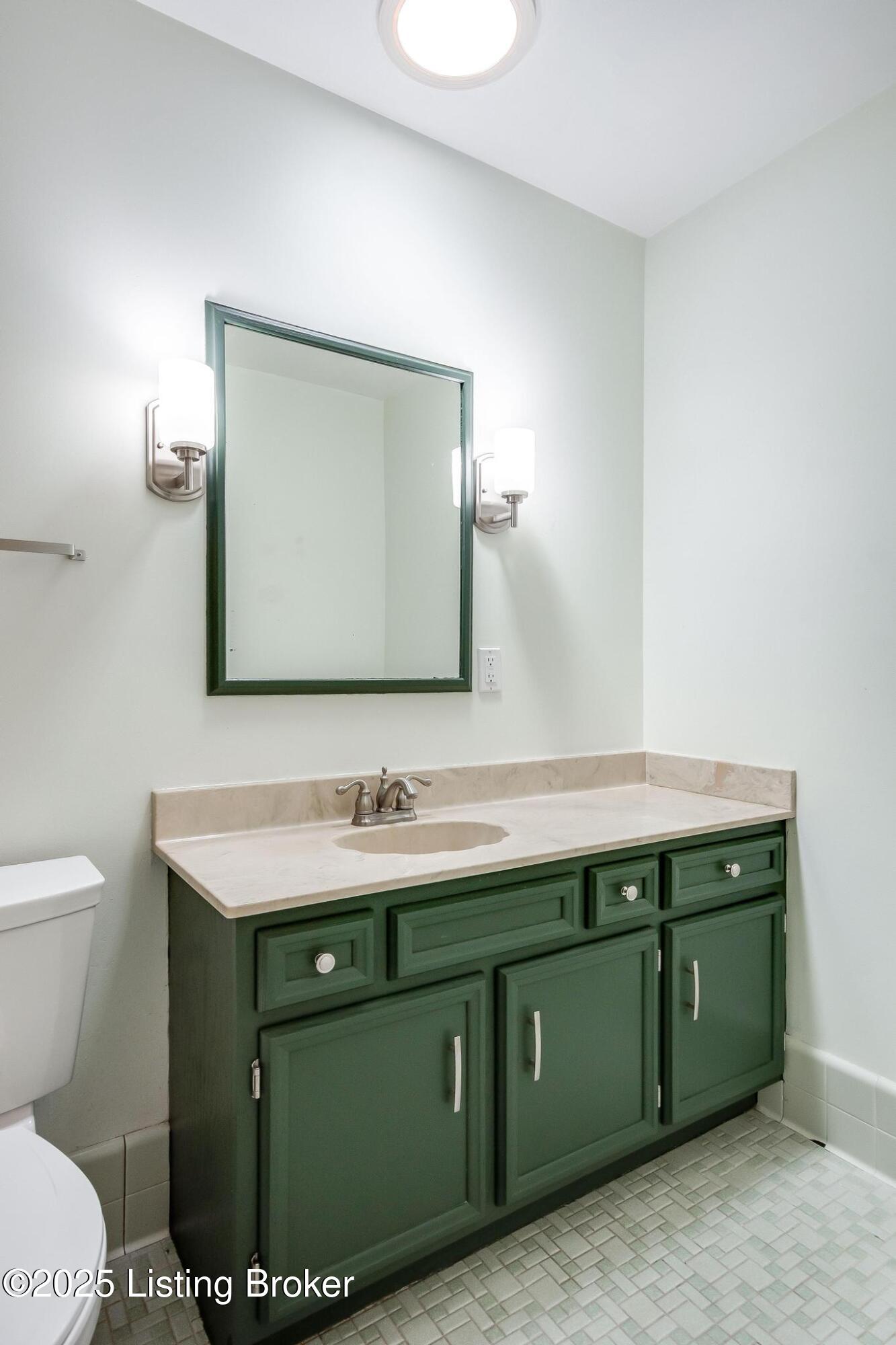9611 Fairground Road Louisville, KY 40291 - Photo 30 of 57 Full Bath #2 with tile flooring, new light fixture, tub and a new toilet.