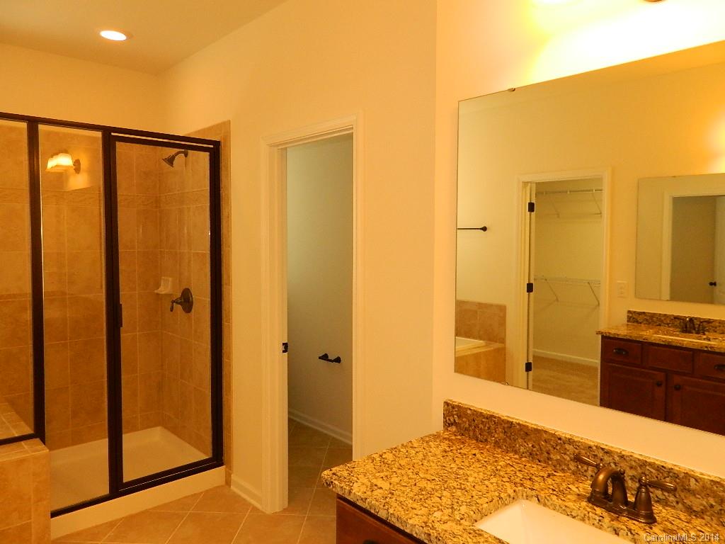 535 Brookhaven Drive, Unit HC77 Fort Mill, SC 29708 - Photo 8 of 10 a bedroom with a bed and a dresser