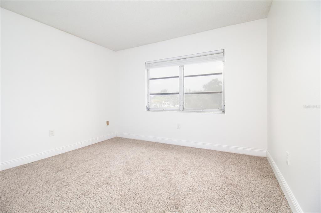 389 South McMullen Booth Road, Unit 12 Clearwater, FL 33759 - Photo 20 of 25 an empty room with a window