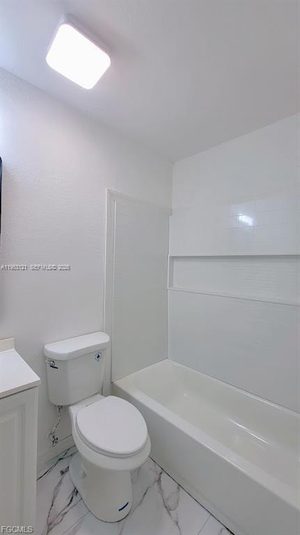 4008 Rye Court LaBelle, FL 33935 - Photo 12 of 12 a a white toilet sitting next to a bath tub and a shower