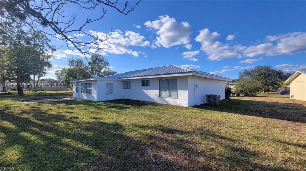 4008 Rye Court LaBelle, FL 33935 - Photo 2 of 12 a view of a house with a yard