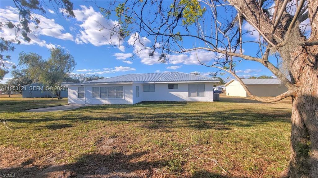 4008 Rye Court LaBelle, FL 33935 - Photo 3 of 12 a view of a house with a yard