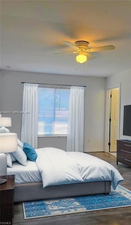 4008 Rye Court LaBelle, FL 33935 - Photo 6 of 12 a bedroom with a bed and a couch